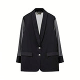 Front studio view of a black Nenette blazer with long, semi-sheer plissé sleeves, a satin shawl lapel, and two front buttons against a solid white background.