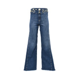 Front studio view of Nenette mid-wash blue wide-leg jeans showcasing a high-rise waist accented with large gold grommets against a plain white background.