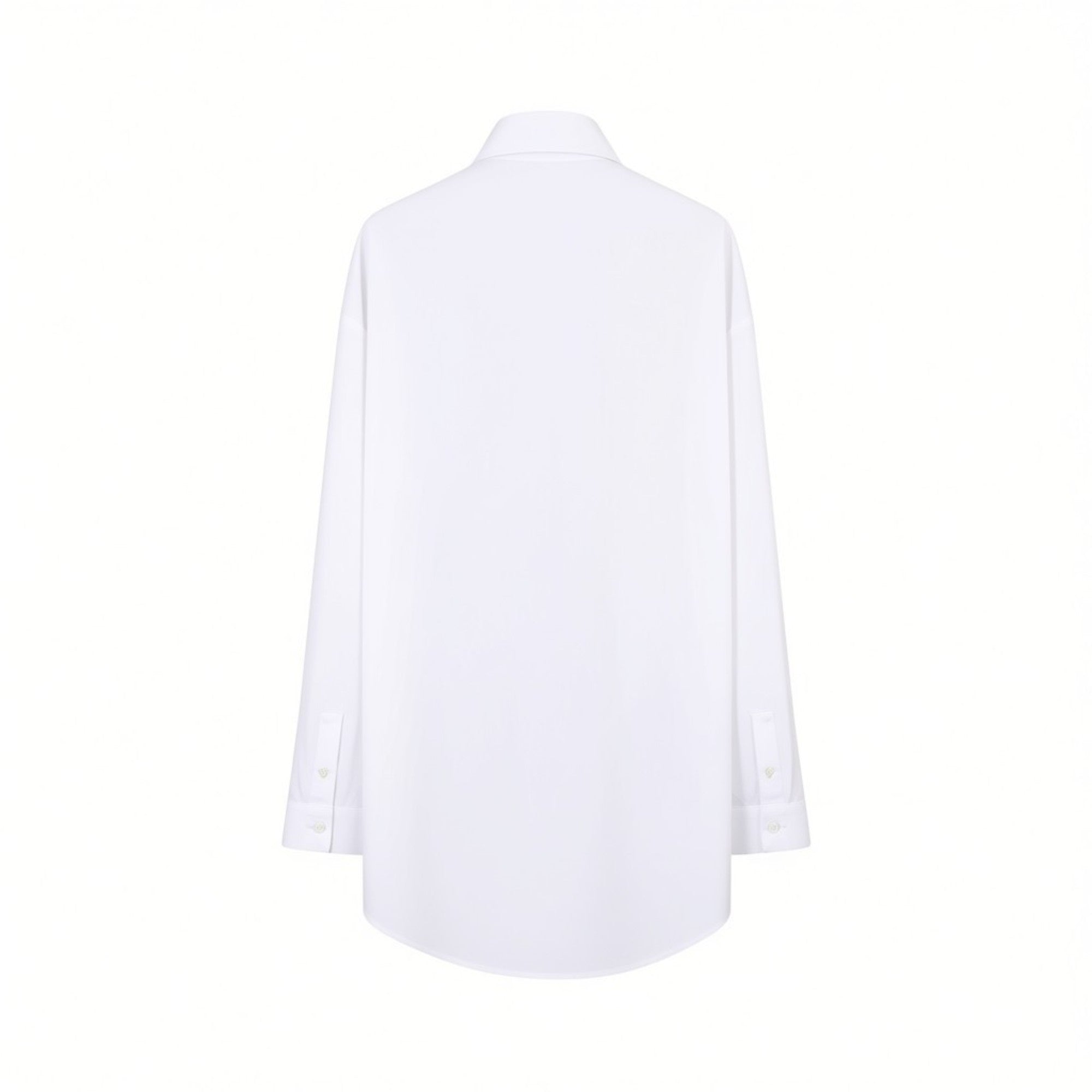 Back studio view of the white Nenette shirt showing its clean, plain fabric, relaxed structure, dropped shoulders, and slightly curved high-low hem.