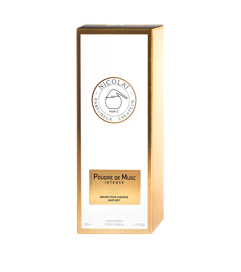 The elegant white and gold-bordered presentation box for the Nicolaï Poudre de Musc Intense Hair Mist, showing the 50ml size marking.