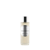 A 100ml clear cylindrical glass bottle of Nicolai Ambre Précieux Home Spray. The bottle features a sleek silver-tone cap and a circular silver label.