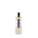 A 100ml clear cylindrical glass bottle of Nicolai Bal à Venise Home Spray shown next to its white and silver presentation box. The bottle features a sleek silver cap and a circular silver label.