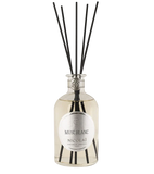 Nicolai Musc Blanc diffuser bottle with black reeds on a white background.