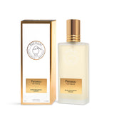 The 50ml frosted bottle of Nicolaï Patchouli Intense Hair Mist standing next to its elegant white and gold-bordered packaging.