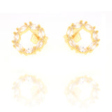 Pair of gold-toned stud earrings with a circular design, each set with multiple clear marquise-cut stones.