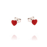 Pair of silver-toned stud earrings, each featuring a small, glossy red heart motif with a butterfly push-back closure.