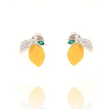 Pair of silver-toned stud earrings, each featuring a yellow lemon with a pavé-set clear stone leaf and small green stone leav