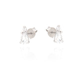 Pair of silver-toned stud earrings, each with a small clear round stone and a larger clear pear-shaped drop stone.