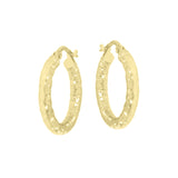 Pair of gold-toned oval hoop earrings with a hammered texture and hinged closures.