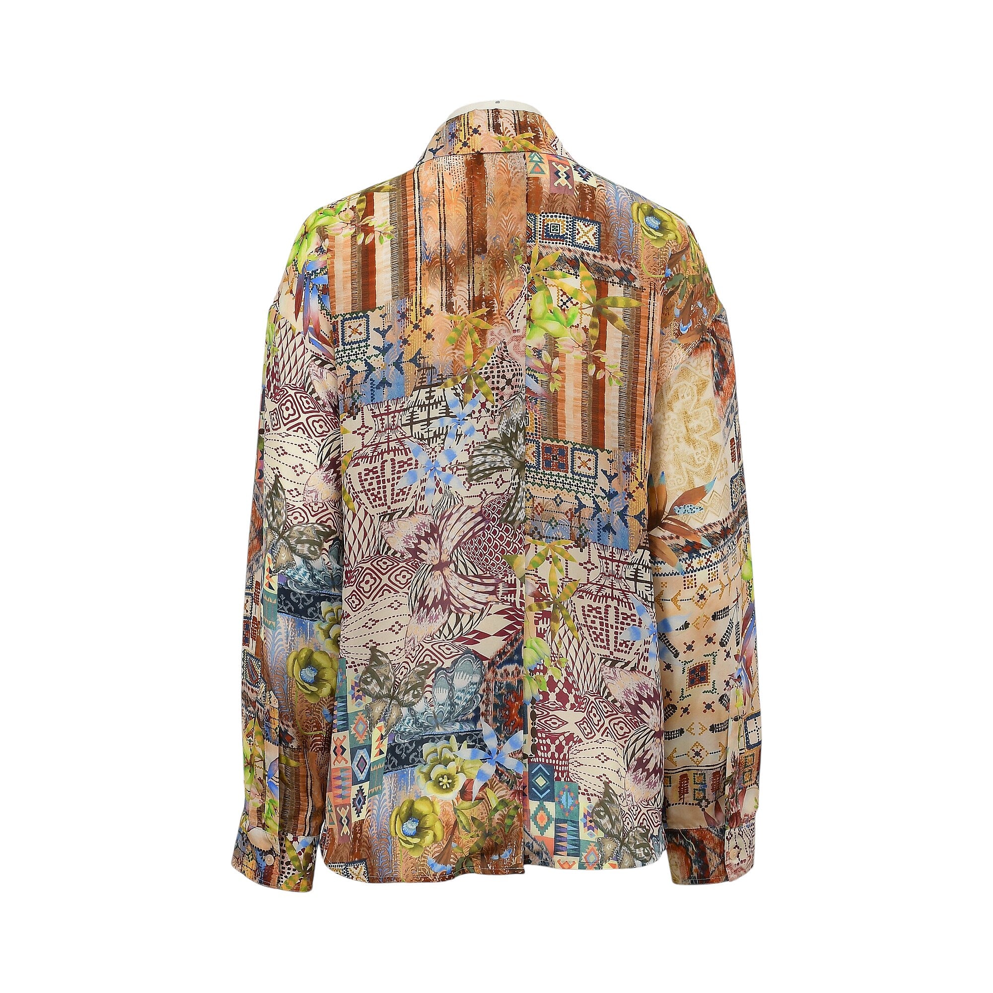 Back of a long-sleeved collared shirt with a multicolored patchwork print featuring floral, geometric, and abstract designs.