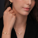 Complementary close-up portrait of a model wearing the crystal-embellished Cerruti 1881 Francesca Double C gold-plated earrings.
