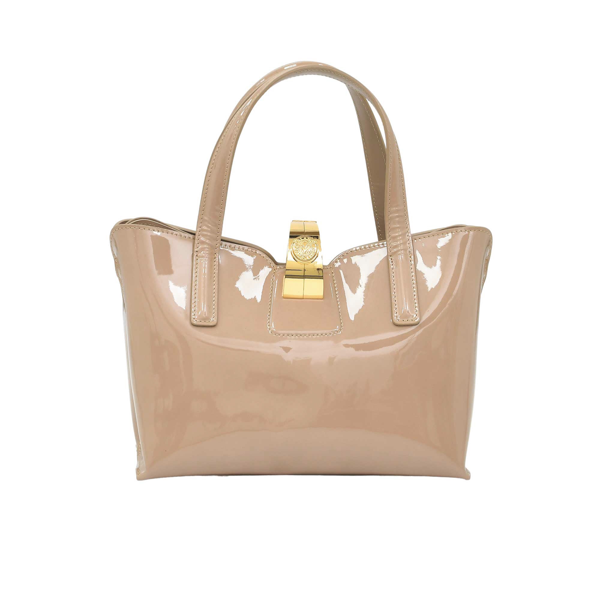 Beige handbag with a gold clasp on a white background.