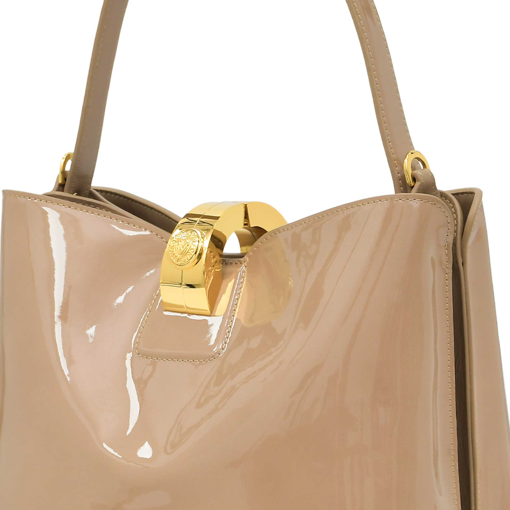 Beige handbag with a gold clasp on a white background.