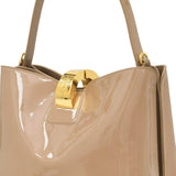 Beige handbag with a gold clasp on a white background.