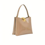 Alternate three-quarter angle view highlighting the mirror-like sheen of the premium beige patent leather material.