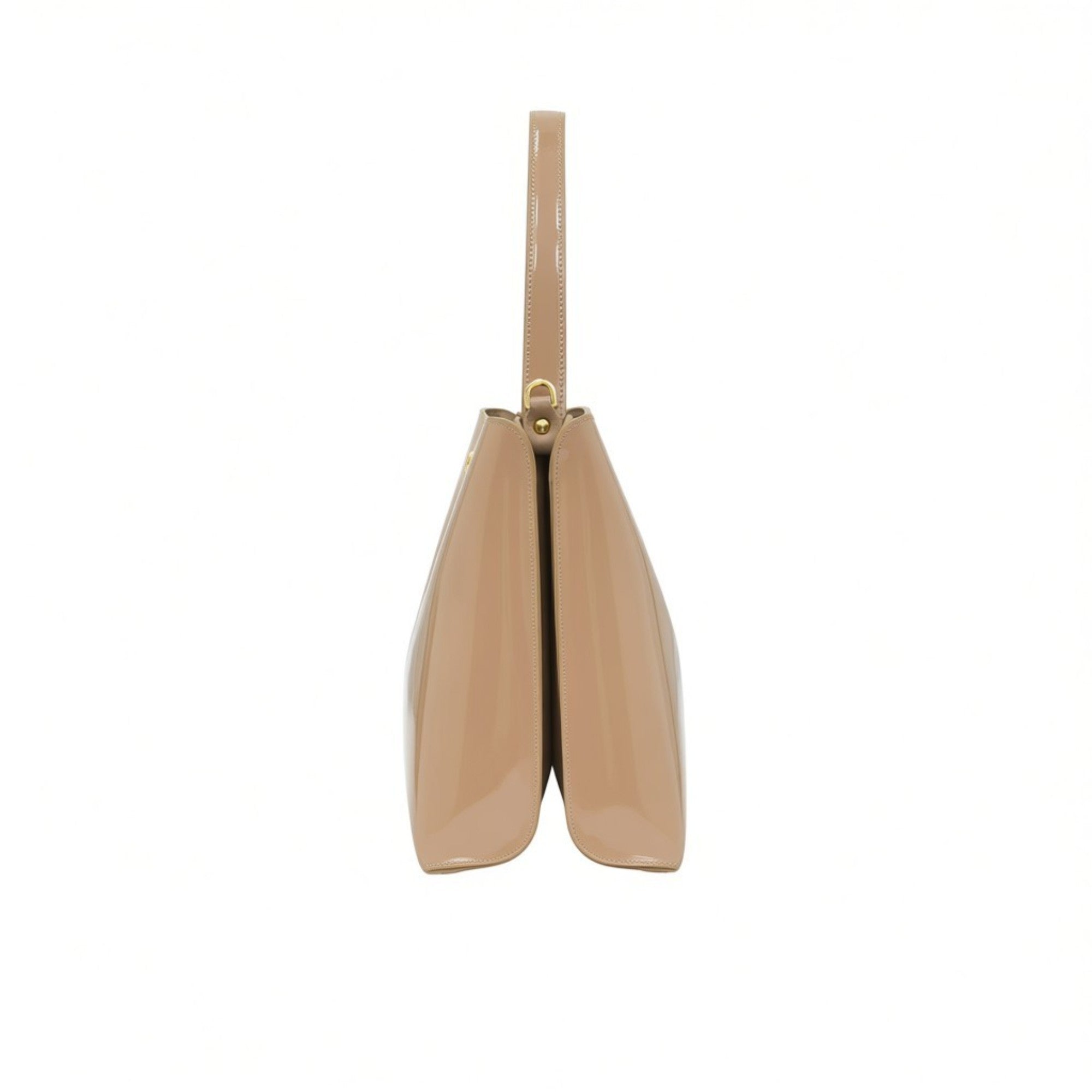 Side profile view of the sleek beige patent leather handbag showing its structured dual-compartment gusset design.