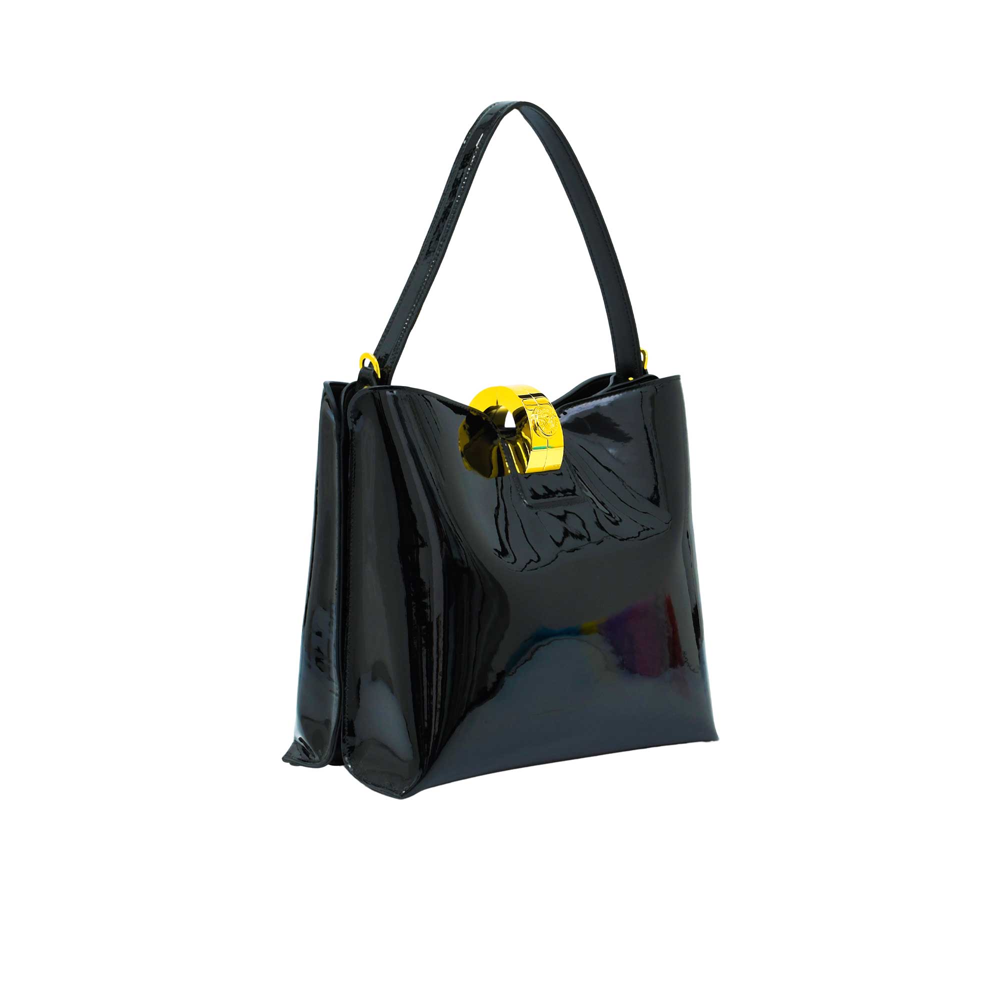 Three-quarter perspective view of the glossy Black patent leather handbag, showcasing its gold-accented hardware.