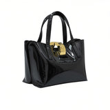 Black glossy handbag with gold clasp on a white background.