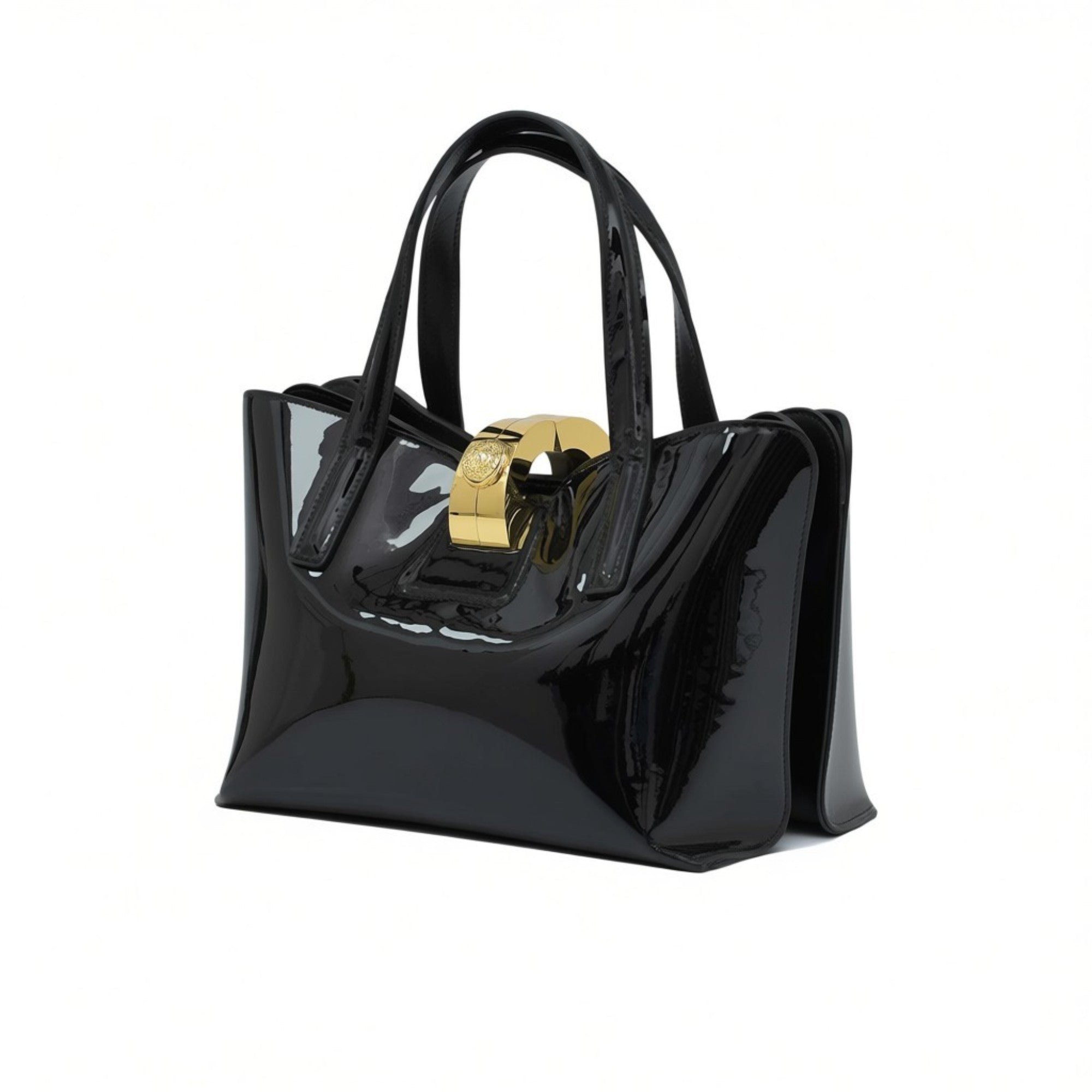 Black patent leather handbag with a gold clasp on a white background.