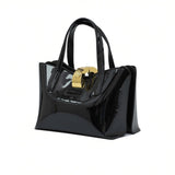 Black patent leather handbag with a gold clasp on a white background.