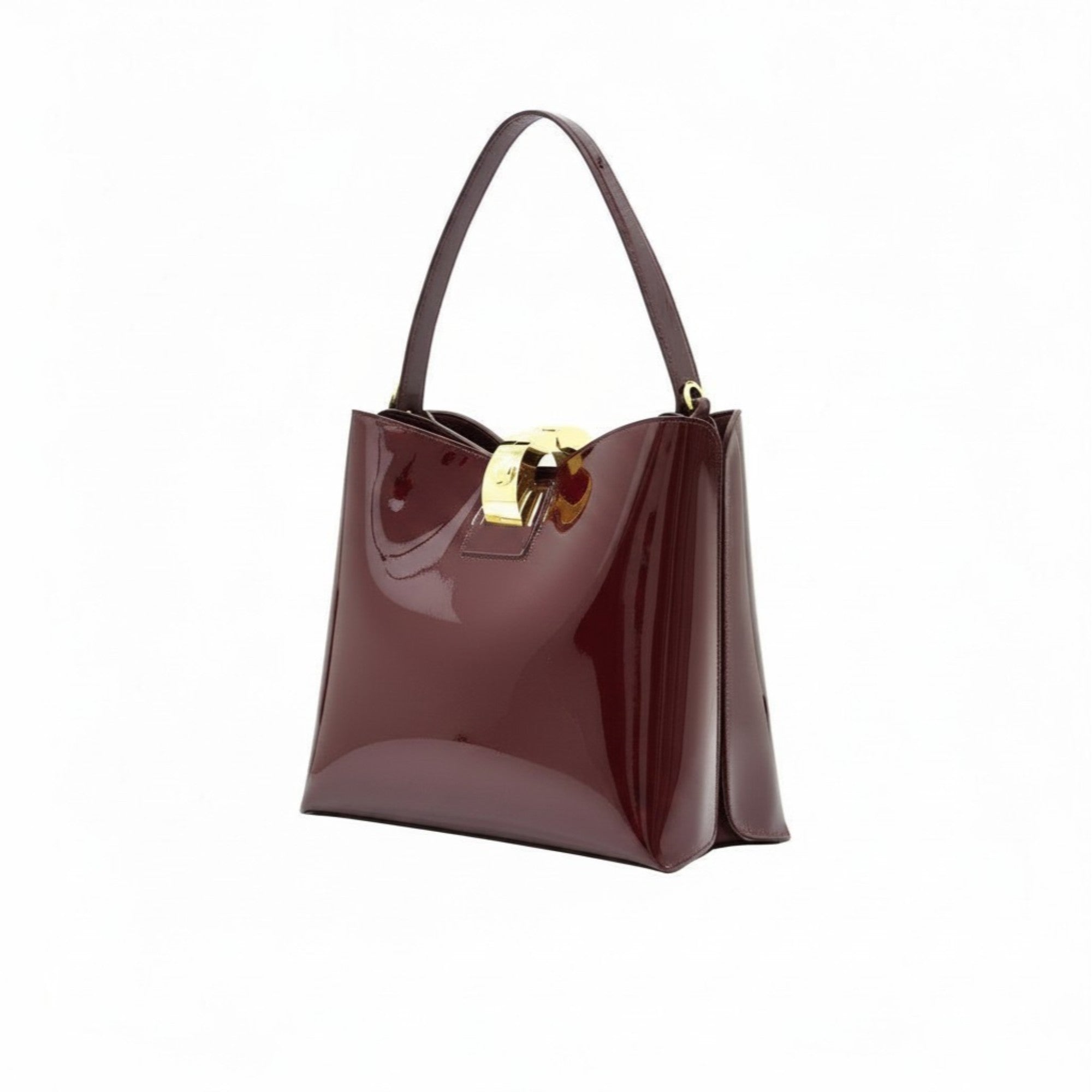 Three-quarter perspective view of the glossy burgundy patent leather handbag, showcasing its gold-accented hardware.
