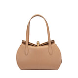 Front view of a nude beige Valentino Orlandi leather handbag with a unique curved top edge and gold-tone turn-lock clasp.