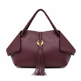 Clean front-facing studio shot of the burgundy leather handbag showing its symmetrical shape and gold-tone hardware logo accent.