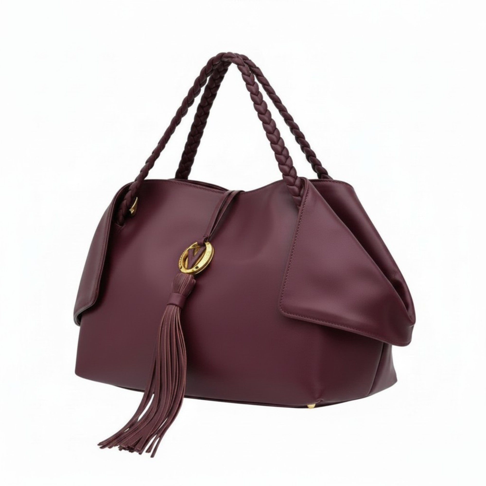 Three-quarter left angle view of the burgundy leather tote bag showcasing its supple grain leather texture and structured silhouette.
