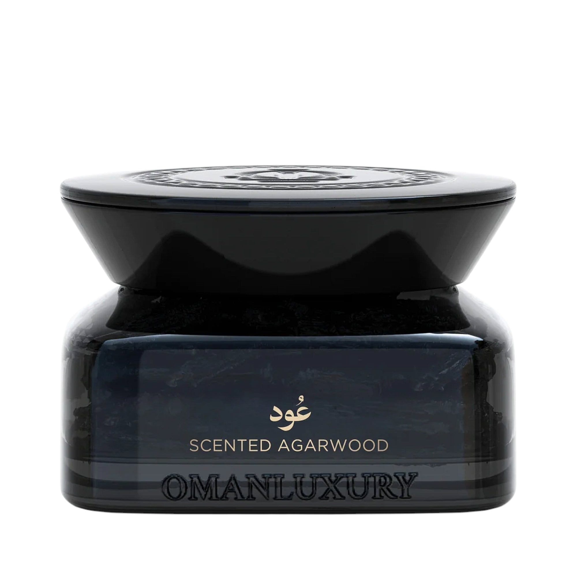 Black translucent container of scented agarwood with a glossy black lid and gold-toned text.