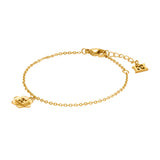 A full layout studio photograph of the Escada Ava bracelet, showing the gold-plated fine link chain, the suspended flower monogram charm, and the lobster clasp with its adjustable extension track.