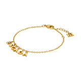A full-length studio product presentation of the Escada Belle bracelet, displaying the gold-plated cable chain, the suspended dangling ESCADA letter charms featuring a crystal-paved initial letter, and the lobster clasp assembly.