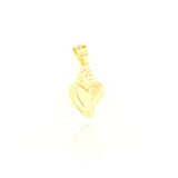 Small gold-toned sacred heart charm with a polished finish and textured flame details, featuring an integrated bail.