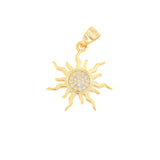 Gold-toned sun charm with wavy rays and a central disc embellished with small, clear, round stones.