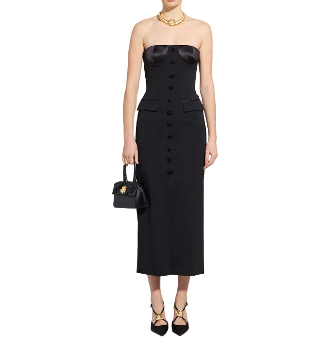 Black strapless midi dress with a satin bustier, full-length button placket, and two decorative flap pockets.