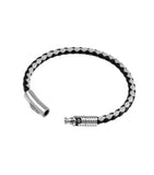 Braided black and grey leather bracelet with a silver-toned cylindrical clasp. One end is smooth with 'POLICE' engraved, the