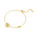 Gold-toned chain bracelet with a floral charm featuring a central clear crystal and smaller crystals. Includes a 'P' charm an