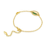 Gold-toned chain bracelet with an oval charm featuring green malachite, "POLICE" text, and clear stones. Lobster clasp.