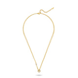 Gold-toned duochain necklace with a small clear crystal on one chain and a crystal-encrusted open circle pendant.