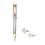 Silver-toned pen with gold-toned clip and tip, alongside two silver-toned cufflinks with gold-toned and white emblems.
