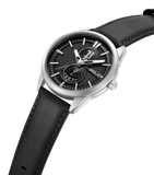 Silver-toned watch with a black textured dial, silver-toned markers, "P" logo, "1987" and "POLICE" sub-dials, and a black lea