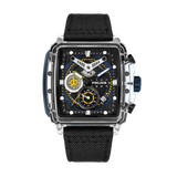 Square watch with clear outer case, black inner frame, black and blue dial with yellow details, and black textured strap.