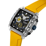 Rectangular watch with clear TR90 case, black and blue dial with yellow accents, bright yellow silicone strap, blue crown, an