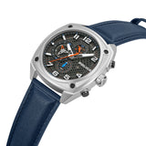 Silver-toned square watch with gunmetal honeycomb dial, white numerals, orange/blue accents, and a blue leather strap.