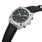 Silver-toned angular watch with a gunmetal honeycomb dial, white numerals, blue and red accents, and a black leather-textured