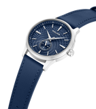 Silver-toned watch with a textured blue dial, silver-toned hands and markers, a sub-dial, and a blue leather strap with stitc