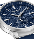 Silver-toned watch with a blue dial featuring a geometric textured pattern, silver-toned hands and bar markers, a sub-dial, a