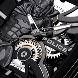Black silicon watch with a gunmetal 3D Batman dial, silver-toned skeleton hands, visible silver and gold-toned gears, and 'PO