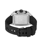 Back view of a watch with a clear rectangular case, black pushers, and a silver-toned back. Black silicone strap with a black