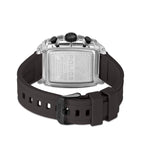 Clear rectangular watch with silver-toned engraved case back, black crown, and dark brown silicone strap with black buckle.
