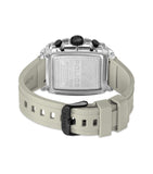 Back of a watch with a clear rectangular case, silver-toned engraved back, black buttons, and a beige silicone strap with a b
